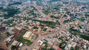Aerial View of a Suburban Neighborhood with Dense Housing and Green Spaces in Africa Cameroon