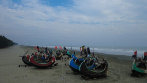 Cox’s Bazar Traditional Wooden Fishermen's fishing boat, Teknaf Coxs bazar, Bangladesh. Colorful Wooden Fishing Boat On a Cox's Bazar Sea Beach With Blue Background in Bangladesh