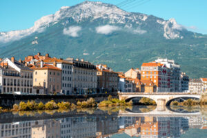 Grenoble Morning cityscape view with mountains, river and bridge in Grenoble city on the south-east of France