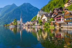 Hallstatt Scenic picture-postcard view of famous Hallstatt village reflecting in Hallstattersee lake in the Austrian Alps in beautiful morning light on a sunny day in summer, Salzkammergut region, Austria.
