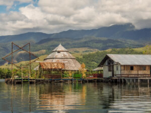 Jayapura Jayapura, Indonesia - January 24, 2015: Stilt houses in Kampung Ayapo, Lake Sentani, Papua, Indonesia