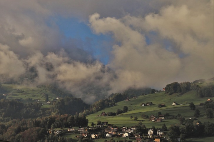 Mountain village covered with clouds