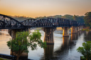 Kanchanaburi Landscape of Bridge River Kwai at Kanchanaburi, Thailand in sunset time. Is a famous place and a tourist destination