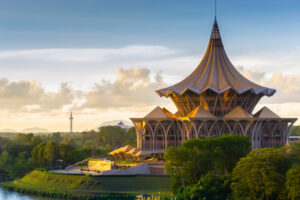 Kuching Kuching, Malaysia – August 20, 2014: Kuching, Sarawak, Malaysia, May 2014: View of the Esplanade on the riverside in Kuching, Malaysia - Borneo during sunset.