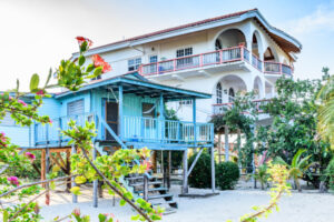 Placencia Houses on sand next to Caribbean beach, Placencia, Belize