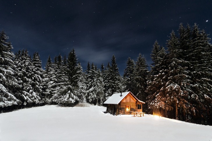 Wooden cabin at night