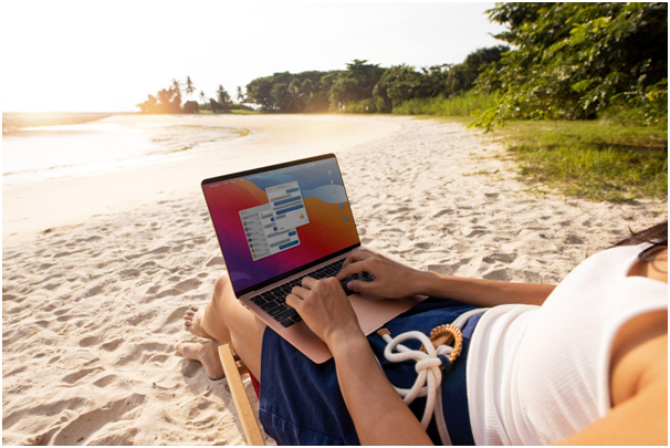Sitting on the beach with a laptop