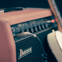 An amplifier and a guitar