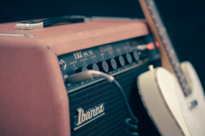 An amplifier and a guitar