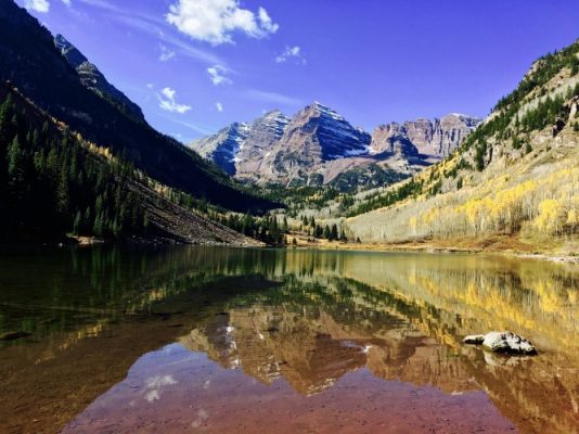 Bare hills reflecting in a lake