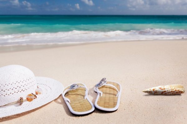 Slippers and a hat on the beach