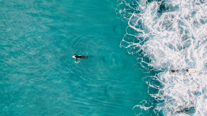 Wave running after a surfer