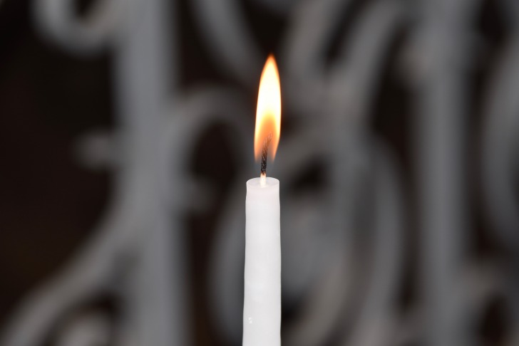 Burning white candle