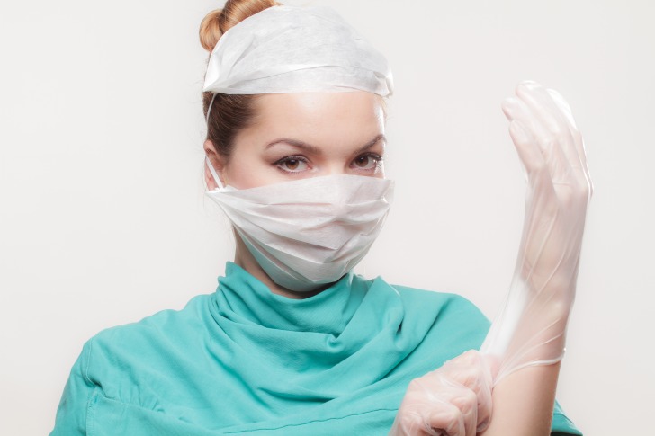 Female doctor wearing gloves