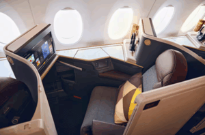 The interior of an Etihad Airways business class cabin, specifically featuring their new Business Class Suites on the Airbus A350-1000 aircraft.