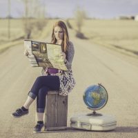 A girl with a globe and a map