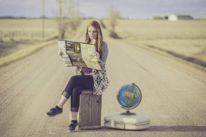 A girl with a globe and a map