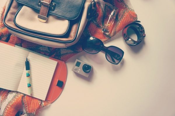Sunglasses, a camera and a rucksack