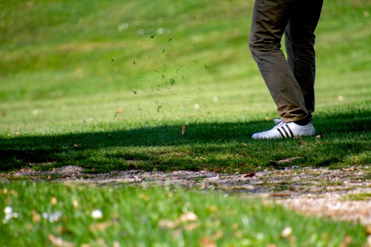 A man playing golf