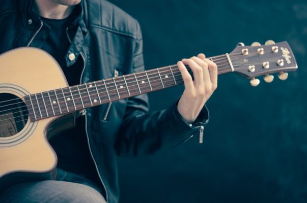 Musician plying the guitar