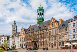 Mons Mons, Hainaut, Wallonia, Belgium. Beautiful architecture on Central Square with Town Hall and beautiful historical buildings on a summer day.