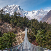 Suspenion bridge in Manaslu circuit trekking route, Himalayas mountain range in Nepal, Asia