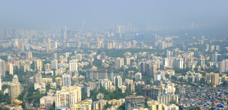 Panoramic aerial view of foggy, polluted, crowded extended suburbs of Navi Mumbai (New Bombay)