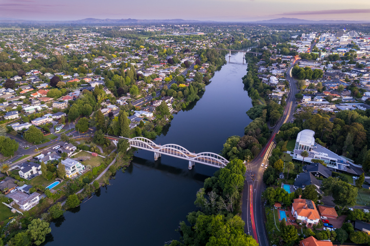 Aerial drone view at sunset of Hamilton City (Kirikiriroa) in the Waikato Region of New Zealand, Aotearoa