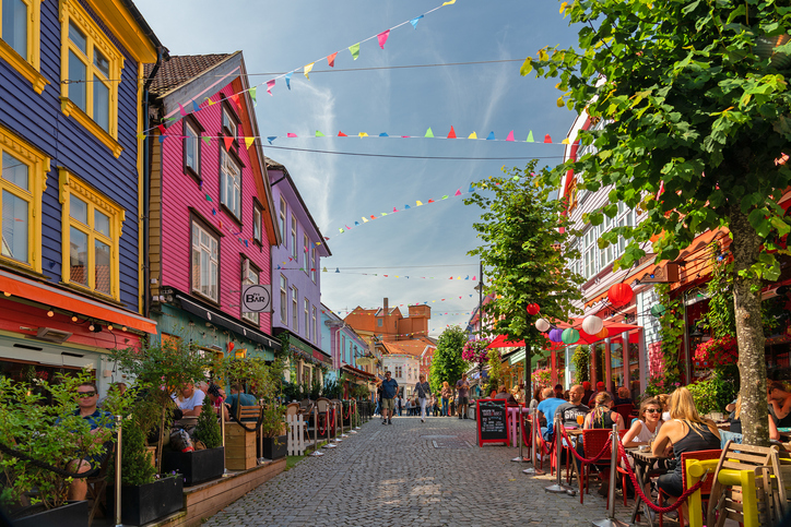 Norway: historical street in Stavanger old town with multicolor wooden houses.