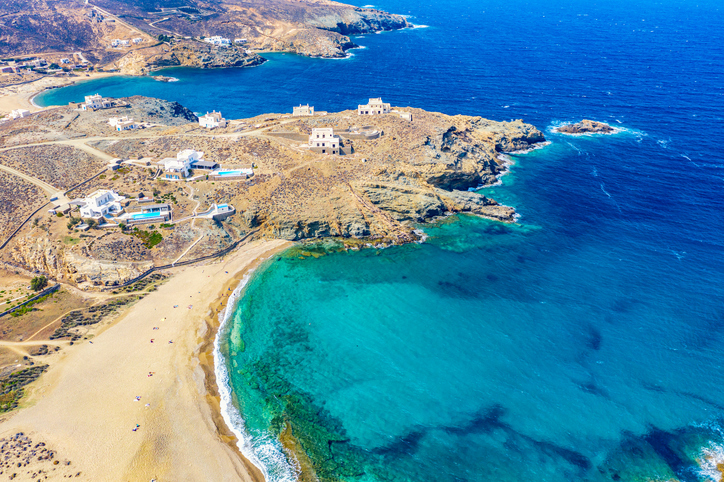 Aerial drone view of Fokos beach on Mykonos island, Greece.