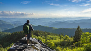 Man relaxing on hiking trip in the mountains.