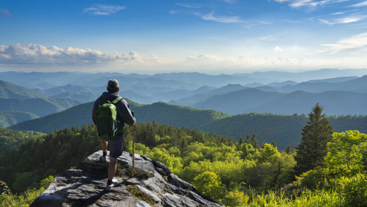 Man relaxing on hiking trip in the mountains.