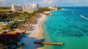 Palm Beach Palm beach Aruba Caribbean, white long sandy beach with palm trees at Aruba
