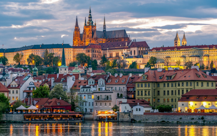Prague Castle with St. Vitus Cathedral over Lesser town (Mala Strana) at sunset, Czech Republic