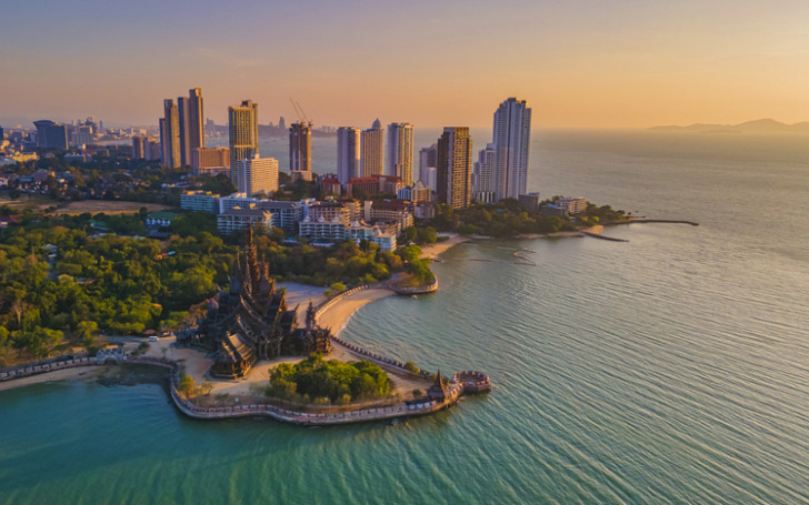Sanctuary of Truth, Pattaya, Thailand, wooden temple by the ocean at sunset on the beach of Pattaya
