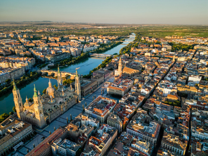 Spectacular Zaragoza city skyline at sunset.