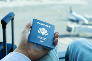 Man holding US passport in his hand and waiting for the immigration.