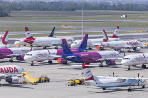 Airport ramp full with airplanes of competitors Ryanair, Lauda, Wizzair and Austrian Airlines