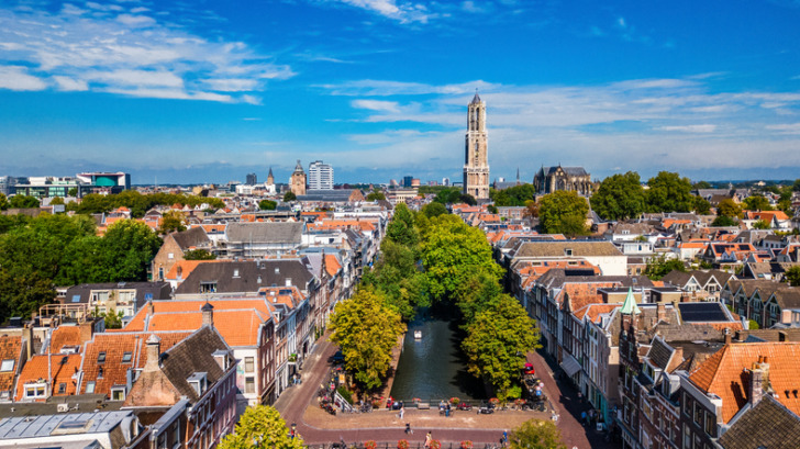 Utrecht town аerial drone view from above, typical Dutch city skyline, Utrecht cityscape with tower, canals and houses, Holland, Netherlands