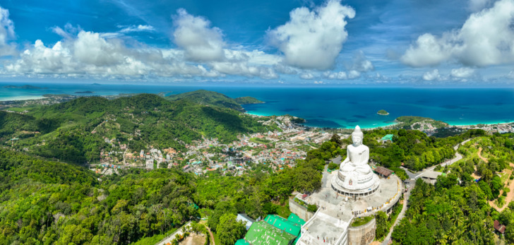 Vesak day background concept of Big buddha over high mountain in Phuket thailand Aerial view drone shot