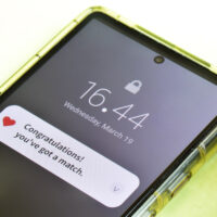 Close-up of Mobile congratulatory notification about a profile match in a dating app.
