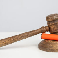 Judge's gavel hits disposable vape. Smoking ban.