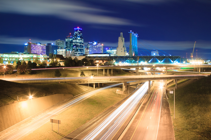 A long exposure of an elevated view of Kansas City, Missouri skyline at night.