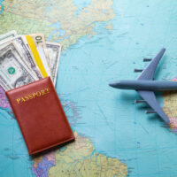 Passport and toy plane.