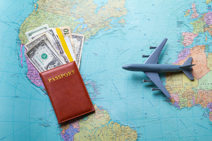 Passport and toy plane.