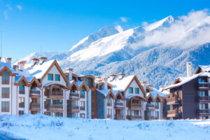 Bansko Houses and snow mountains panorama in bulgarian ski resort Bansko