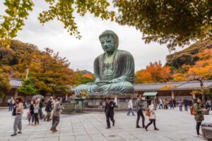Tourists at statue of The Great Buddha of Kamakura, Japan