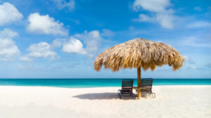 Eagle Beach Straw umbrella on Eagle Beach, Aruba on a lovely summer day