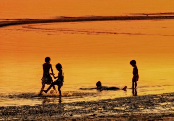 Kids playing on the beach