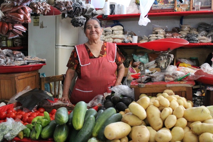 Mexican woman selling vegetables